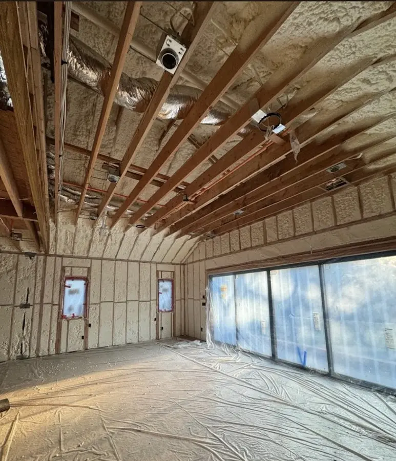 Interior walls and ceiling insulated with spray foam during new construction in North Smithfield